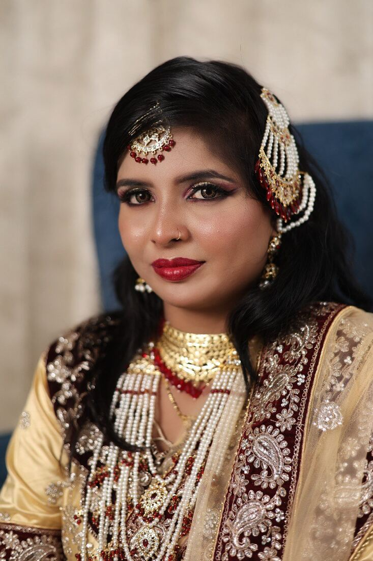 Maroon and gold bridal closeup